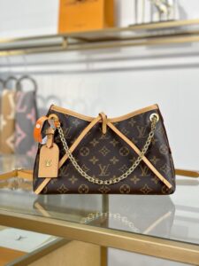 CarryAll BB. Authentic quality luxury bag crafted in genuine leather comes with authenticity card, dust bag and gift bag. Effortless Elegance, Day to Night – The CarryAll BB Reimagined. The iconic CarryAll BB returns this season with a stylish twist, perfect for transitioning from day to evening. Expertly crafted from the House’s signature Monogram canvas, it’s elevated with a gleaming gold-toned chain adorned with Monogram Flowers. Thoughtful details like the contrasting leather name tag and matching lace closure add a refined touch. Inside, a zipped pocket offers a convenient spot to keep your everyday essentials—like a credit card—close at hand. - CRIS&COCO CarryAll BB. Authentic quality luxury bag crafted in genuine leather comes with authenticity card, dust bag and gift bag. Effortless Elegance, Day to Night – The CarryAll BB Reimagined. The iconic CarryAll BB returns this season with a stylish twist, perfect for transitioning from day to evening. Expertly crafted from the House’s signature Monogram canvas, it’s elevated with a gleaming gold-toned chain adorned with Monogram Flowers. Thoughtful details like the contrasting leather name tag and matching lace closure add a refined touch. Inside, a zipped pocket offers a convenient spot to keep your everyday essentials—like a credit card—close at hand.