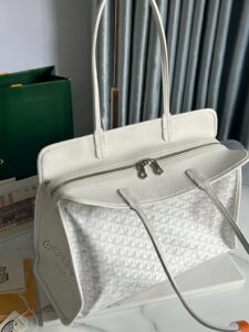 Hardy PM Bag. Authentic quality luxury bag crafted in genuine leather comes with authenticity card, dust bag and gift bag. Effortless Elegance, Everyday Function. The Hardy PM bag is the perfect companion for everyday use or work, easily fitting A4 files with ease. Designed for those who value lightness, flexibility, and added security, it features a zip closure to keep your essentials safe. With long, comfortable handles, it's ideal for carrying over the shoulder all day with ease. - CRIS&COCO Hardy PM Bag. Authentic quality luxury bag crafted in genuine leather comes with authenticity card, dust bag and gift bag. Effortless Elegance, Everyday Function. The Hardy PM bag is the perfect companion for everyday use or work, easily fitting A4 files with ease. Designed for those who value lightness, flexibility, and added security, it features a zip closure to keep your essentials safe. With long, comfortable handles, it's ideal for carrying over the shoulder all day with ease.
