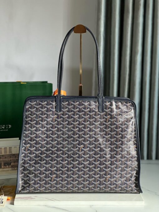 Hardy PM Bag. Authentic quality luxury bag crafted in genuine leather comes with authenticity card, dust bag and gift bag. Effortless Elegance, Everyday Function. The Hardy PM bag is the perfect companion for everyday use or work, easily fitting A4 files with ease. Designed for those who value lightness, flexibility, and added security, it features a zip closure to keep your essentials safe. With long, comfortable handles, it's ideal for carrying over the shoulder all day with ease.