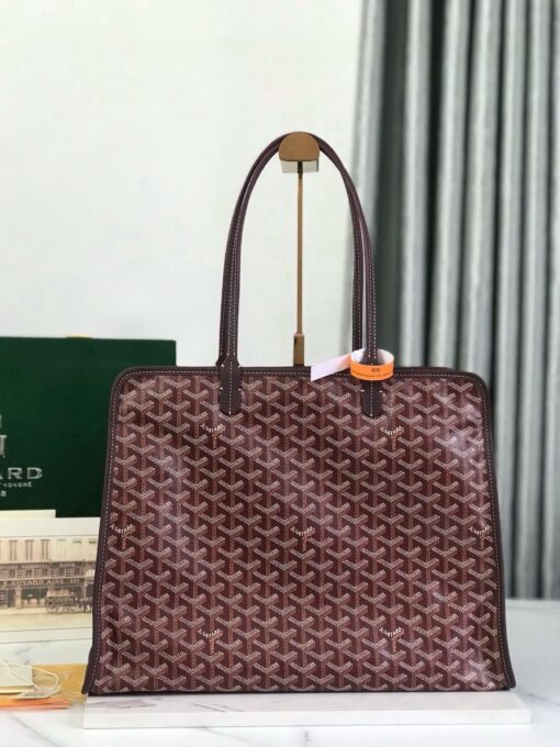 Hardy PM Bag. Authentic quality luxury bag crafted in genuine leather comes with authenticity card, dust bag and gift bag. Effortless Elegance, Everyday Function. The Hardy PM bag is the perfect companion for everyday use or work, easily fitting A4 files with ease. Designed for those who value lightness, flexibility, and added security, it features a zip closure to keep your essentials safe. With long, comfortable handles, it's ideal for carrying over the shoulder all day with ease.