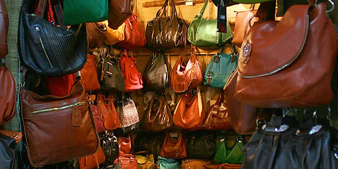 A craftsman working on leather goods in Shenzhen