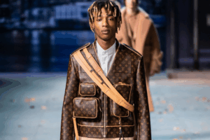 Collage of luxury fashion logos torn apart by finance and corporate symbolism