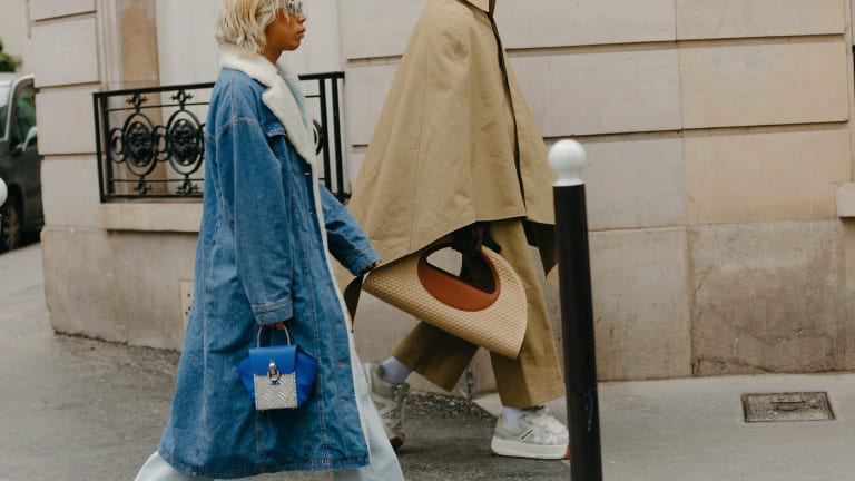 A woman holding a luxury handbag A woman holding a luxury handbag
