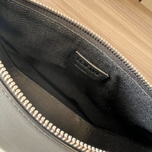 Mini Hammock Hobo. Authentic quality luxury bag crafted in genuine leather comes with authenticity card, dust bag and gift bag. Effortless Form, Everyday Function.  The Mini Hammock Hobo is a contemporary reimagining of Loewe’s iconic Hammock bag. This streamlined variation offers a sleek, sculptural silhouette designed as a versatile sling bag for modern living. Expertly crafted in classic calfskin, it features soft, supple leather and a compact form that adapts effortlessly to your day. The unique design allows for multiple carry options—wear it crossbody, over the shoulder, or by hand. Elegant yet functional, this mini hobo is perfect for essentials, making it an ideal choice for both daily wear and minimalist style statements.