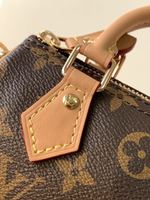 Speedy Nano. Authentic quality luxury bag crafted in genuine leather comes with authenticity card, dust bag and gift bag. Iconic Style, Perfectly Miniaturized. Meet the LV Speedy Nano — a petite powerhouse that captures the timeless allure of the iconic Speedy in its most charming form. Revamped in classic Monogram canvas and finished with aged natural cowhide leather, this mini marvel is made for the modern minimalist. Crafted with delicate gold-tone hardware and featuring two signature top handles, the Speedy Nano is both playful and practical. Its removable, adjustable shoulder strap adds effortless versatility—carry it by hand for polished poise or sling it crossbody for chic, on-the-go ease. Compact enough for your essentials. Iconic enough to turn heads. Small bag, big legacy!
