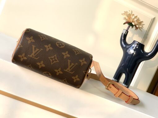 Speedy Nano. Authentic quality luxury bag crafted in genuine leather comes with authenticity card, dust bag and gift bag. Iconic Style, Perfectly Miniaturized. Meet the LV Speedy Nano — a petite powerhouse that captures the timeless allure of the iconic Speedy in its most charming form. Revamped in classic Monogram canvas and finished with aged natural cowhide leather, this mini marvel is made for the modern minimalist. Crafted with delicate gold-tone hardware and featuring two signature top handles, the Speedy Nano is both playful and practical. Its removable, adjustable shoulder strap adds effortless versatility—carry it by hand for polished poise or sling it crossbody for chic, on-the-go ease. Compact enough for your essentials. Iconic enough to turn heads. Small bag, big legacy!