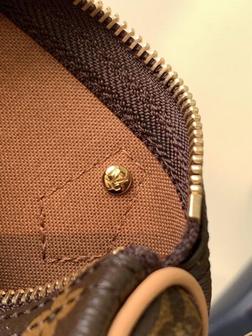 Speedy Nano. Authentic quality luxury bag crafted in genuine leather comes with authenticity card, dust bag and gift bag. Iconic Style, Perfectly Miniaturized. Meet the LV Speedy Nano — a petite powerhouse that captures the timeless allure of the iconic Speedy in its most charming form. Revamped in classic Monogram canvas and finished with aged natural cowhide leather, this mini marvel is made for the modern minimalist. Crafted with delicate gold-tone hardware and featuring two signature top handles, the Speedy Nano is both playful and practical. Its removable, adjustable shoulder strap adds effortless versatility—carry it by hand for polished poise or sling it crossbody for chic, on-the-go ease. Compact enough for your essentials. Iconic enough to turn heads. Small bag, big legacy!