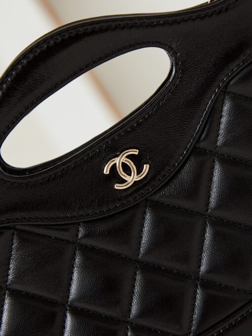 31 Nano Shopping Bag. Authentic quality luxury bag crafted in genuine leather comes with authenticity card, dust bag and gift bag. Small in size, grand in statement.  A miniature marvel that captures the sophistication of *ANEL in its most playful form. Crafted with meticulous precision, this petite icon merges the timeless spirit of the *ANEL 31 with a modern twist on everyday elegance. Designed in supple lambskin and finished with gleaming gold-tone hardware, the Nano 31 doesn’t just carry your essentials — it carries your attitude. Whether worn crossbody, by hand, or dangling from the crook of your arm, this charming piece elevates every ensemble with a whisper of Parisian chic. Perfect for a night out or a day in the spotlight, it’s not just a bag — it’s your boldest accessory in its most compact form. Because luxury doesn't need to shout. Sometimes, it just needs to charm.