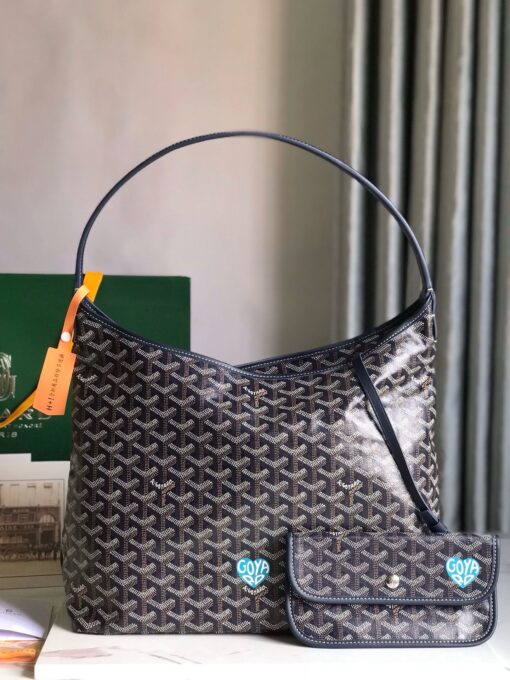 Bohème Hobo Bag. Authentic quality luxury bag crafted in genuine leather comes with authenticity card, dust bag and gift bag. Wander Freely. Carry Elegantly. Introducing the Goyard Bohème Hobo Bag—a tribute to Parisian spirit and wanderlust. Inspired by the timber raftsmen’s humble travel pouches, this bag blends heritage storytelling with everyday luxury. Crafted to be exceptionally lightweight and flexible, it drapes effortlessly on your shoulder with a wide, comfortable handle designed for long city strolls or spontaneous weekend escapes. Its beauty lies not only in its sleek silhouette but also in its thoughtful functionality. The secure zip closure keeps your essentials safe, while the removable snap-fastened pouch doubles as a chic clutch or wallet—perfect for a quick dash or stylish switch-up. Whether you’re wandering through cobblestone streets or navigating your daily routine, the Bohème ensures your essentials are always within reach. This is not just a bag—it’s your elegant partner in carefree adventures.