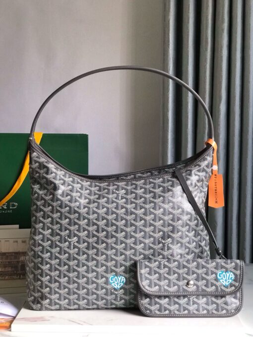 Bohème Hobo Bag. Authentic quality luxury bag crafted in genuine leather comes with authenticity card, dust bag and gift bag. Wander Freely. Carry Elegantly. Introducing the Goyard Bohème Hobo Bag—a tribute to Parisian spirit and wanderlust. Inspired by the timber raftsmen’s humble travel pouches, this bag blends heritage storytelling with everyday luxury. Crafted to be exceptionally lightweight and flexible, it drapes effortlessly on your shoulder with a wide, comfortable handle designed for long city strolls or spontaneous weekend escapes. Its beauty lies not only in its sleek silhouette but also in its thoughtful functionality. The secure zip closure keeps your essentials safe, while the removable snap-fastened pouch doubles as a chic clutch or wallet—perfect for a quick dash or stylish switch-up. Whether you’re wandering through cobblestone streets or navigating your daily routine, the Bohème ensures your essentials are always within reach. This is not just a bag—it’s your elegant partner in carefree adventures.