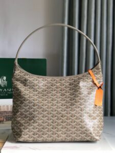 Bohème Hobo Bag. Authentic quality luxury bag crafted in genuine leather comes with authenticity card, dust bag and gift bag. Wander Freely. Carry Elegantly. Introducing the Goyard Bohème Hobo Bag—a tribute to Parisian spirit and wanderlust. Inspired by the timber raftsmen’s humble travel pouches, this bag blends heritage storytelling with everyday luxury. Crafted to be exceptionally lightweight and flexible, it drapes effortlessly on your shoulder with a wide, comfortable handle designed for long city strolls or spontaneous weekend escapes. Its beauty lies not only in its sleek silhouette but also in its thoughtful functionality. The secure zip closure keeps your essentials safe, while the removable snap-fastened pouch doubles as a chic clutch or wallet—perfect for a quick dash or stylish switch-up. Whether you’re wandering through cobblestone streets or navigating your daily routine, the Bohème ensures your essentials are always within reach. This is not just a bag—it’s your elegant partner in carefree adventures.