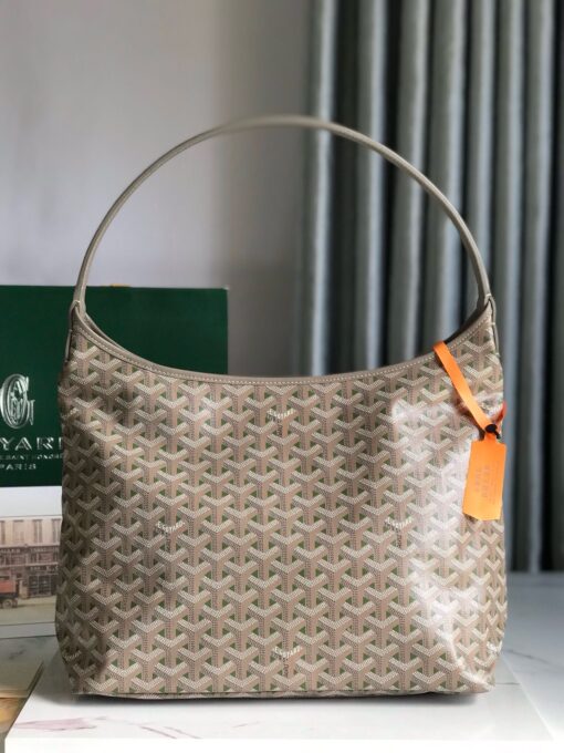 Bohème Hobo Bag. Authentic quality luxury bag crafted in genuine leather comes with authenticity card, dust bag and gift bag. Wander Freely. Carry Elegantly. Introducing the Goyard Bohème Hobo Bag—a tribute to Parisian spirit and wanderlust. Inspired by the timber raftsmen’s humble travel pouches, this bag blends heritage storytelling with everyday luxury. Crafted to be exceptionally lightweight and flexible, it drapes effortlessly on your shoulder with a wide, comfortable handle designed for long city strolls or spontaneous weekend escapes. Its beauty lies not only in its sleek silhouette but also in its thoughtful functionality. The secure zip closure keeps your essentials safe, while the removable snap-fastened pouch doubles as a chic clutch or wallet—perfect for a quick dash or stylish switch-up. Whether you’re wandering through cobblestone streets or navigating your daily routine, the Bohème ensures your essentials are always within reach. This is not just a bag—it’s your elegant partner in carefree adventures.