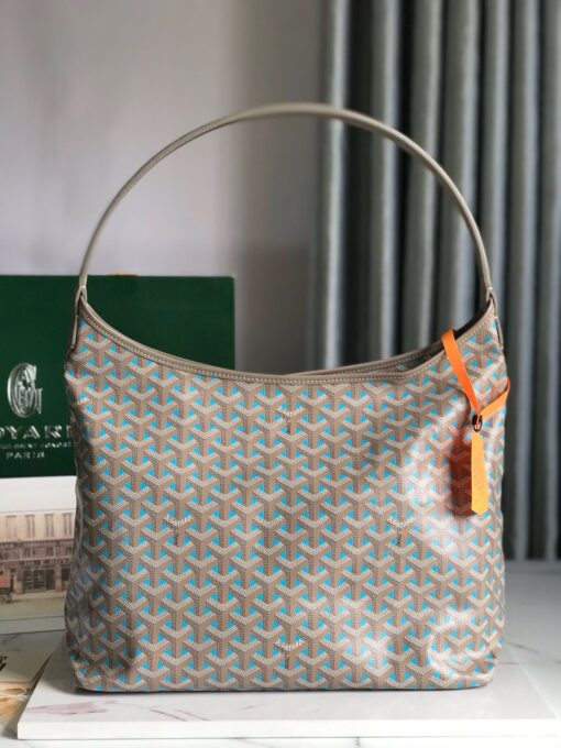 Bohème Hobo Bag. Authentic quality luxury bag crafted in genuine leather comes with authenticity card, dust bag and gift bag. Wander Freely. Carry Elegantly. Introducing the Goyard Bohème Hobo Bag—a tribute to Parisian spirit and wanderlust. Inspired by the timber raftsmen’s humble travel pouches, this bag blends heritage storytelling with everyday luxury. Crafted to be exceptionally lightweight and flexible, it drapes effortlessly on your shoulder with a wide, comfortable handle designed for long city strolls or spontaneous weekend escapes. Its beauty lies not only in its sleek silhouette but also in its thoughtful functionality. The secure zip closure keeps your essentials safe, while the removable snap-fastened pouch doubles as a chic clutch or wallet—perfect for a quick dash or stylish switch-up. Whether you’re wandering through cobblestone streets or navigating your daily routine, the Bohème ensures your essentials are always within reach. This is not just a bag—it’s your elegant partner in carefree adventures.
