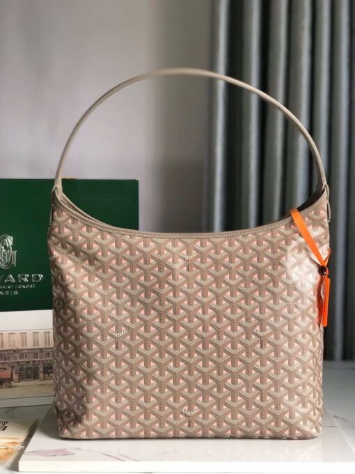 Bohème Hobo Bag. Authentic quality luxury bag crafted in genuine leather comes with authenticity card, dust bag and gift bag. Wander Freely. Carry Elegantly. Introducing the Goyard Bohème Hobo Bag—a tribute to Parisian spirit and wanderlust. Inspired by the timber raftsmen’s humble travel pouches, this bag blends heritage storytelling with everyday luxury. Crafted to be exceptionally lightweight and flexible, it drapes effortlessly on your shoulder with a wide, comfortable handle designed for long city strolls or spontaneous weekend escapes. Its beauty lies not only in its sleek silhouette but also in its thoughtful functionality. The secure zip closure keeps your essentials safe, while the removable snap-fastened pouch doubles as a chic clutch or wallet—perfect for a quick dash or stylish switch-up. Whether you’re wandering through cobblestone streets or navigating your daily routine, the Bohème ensures your essentials are always within reach. This is not just a bag—it’s your elegant partner in carefree adventures.