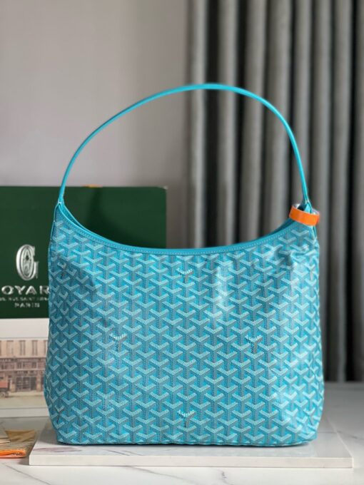 Bohème Hobo Bag. Authentic quality luxury bag crafted in genuine leather comes with authenticity card, dust bag and gift bag. Wander Freely. Carry Elegantly. Introducing the Goyard Bohème Hobo Bag—a tribute to Parisian spirit and wanderlust. Inspired by the timber raftsmen’s humble travel pouches, this bag blends heritage storytelling with everyday luxury. Crafted to be exceptionally lightweight and flexible, it drapes effortlessly on your shoulder with a wide, comfortable handle designed for long city strolls or spontaneous weekend escapes. Its beauty lies not only in its sleek silhouette but also in its thoughtful functionality. The secure zip closure keeps your essentials safe, while the removable snap-fastened pouch doubles as a chic clutch or wallet—perfect for a quick dash or stylish switch-up. Whether you’re wandering through cobblestone streets or navigating your daily routine, the Bohème ensures your essentials are always within reach. This is not just a bag—it’s your elegant partner in carefree adventures.