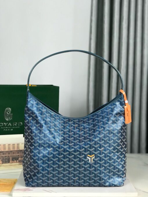 Bohème Hobo Bag. Authentic quality luxury bag crafted in genuine leather comes with authenticity card, dust bag and gift bag. Wander Freely. Carry Elegantly. Introducing the Goyard Bohème Hobo Bag—a tribute to Parisian spirit and wanderlust. Inspired by the timber raftsmen’s humble travel pouches, this bag blends heritage storytelling with everyday luxury. Crafted to be exceptionally lightweight and flexible, it drapes effortlessly on your shoulder with a wide, comfortable handle designed for long city strolls or spontaneous weekend escapes. Its beauty lies not only in its sleek silhouette but also in its thoughtful functionality. The secure zip closure keeps your essentials safe, while the removable snap-fastened pouch doubles as a chic clutch or wallet—perfect for a quick dash or stylish switch-up. Whether you’re wandering through cobblestone streets or navigating your daily routine, the Bohème ensures your essentials are always within reach. This is not just a bag—it’s your elegant partner in carefree adventures.