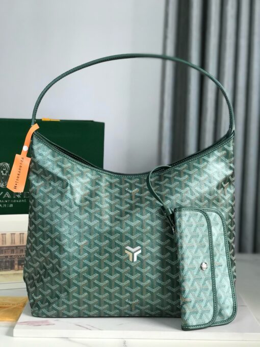 Bohème Hobo Bag. Authentic quality luxury bag crafted in genuine leather comes with authenticity card, dust bag and gift bag. Wander Freely. Carry Elegantly. Introducing the Goyard Bohème Hobo Bag—a tribute to Parisian spirit and wanderlust. Inspired by the timber raftsmen’s humble travel pouches, this bag blends heritage storytelling with everyday luxury. Crafted to be exceptionally lightweight and flexible, it drapes effortlessly on your shoulder with a wide, comfortable handle designed for long city strolls or spontaneous weekend escapes. Its beauty lies not only in its sleek silhouette but also in its thoughtful functionality. The secure zip closure keeps your essentials safe, while the removable snap-fastened pouch doubles as a chic clutch or wallet—perfect for a quick dash or stylish switch-up. Whether you’re wandering through cobblestone streets or navigating your daily routine, the Bohème ensures your essentials are always within reach. This is not just a bag—it’s your elegant partner in carefree adventures.