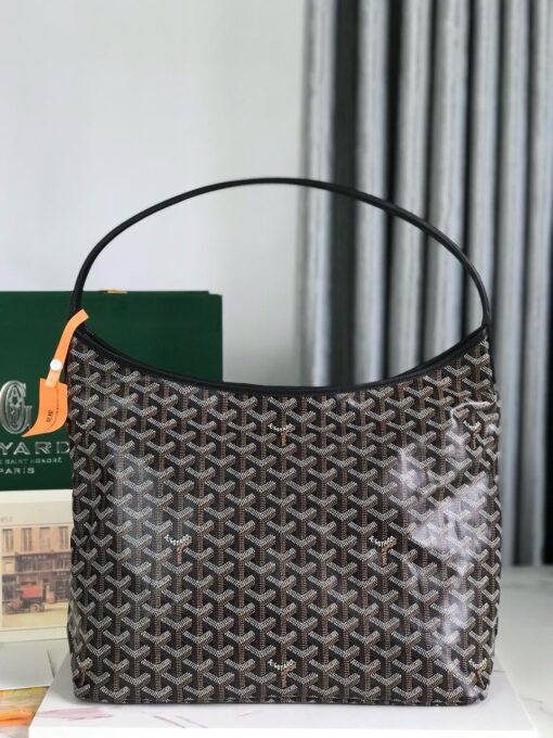 Bohème Hobo Bag. Authentic quality luxury bag crafted in genuine leather comes with authenticity card, dust bag and gift bag. Wander Freely. Carry Elegantly. Introducing the Goyard Bohème Hobo Bag—a tribute to Parisian spirit and wanderlust. Inspired by the timber raftsmen’s humble travel pouches, this bag blends heritage storytelling with everyday luxury. Crafted to be exceptionally lightweight and flexible, it drapes effortlessly on your shoulder with a wide, comfortable handle designed for long city strolls or spontaneous weekend escapes. Its beauty lies not only in its sleek silhouette but also in its thoughtful functionality. The secure zip closure keeps your essentials safe, while the removable snap-fastened pouch doubles as a chic clutch or wallet—perfect for a quick dash or stylish switch-up. Whether you’re wandering through cobblestone streets or navigating your daily routine, the Bohème ensures your essentials are always within reach. This is not just a bag—it’s your elegant partner in carefree adventures.