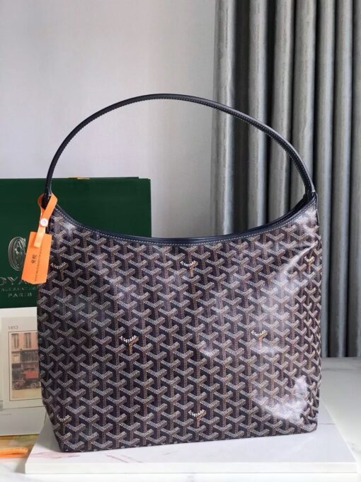 Bohème Hobo Bag. Authentic quality luxury bag crafted in genuine leather comes with authenticity card, dust bag and gift bag. Wander Freely. Carry Elegantly. Introducing the Goyard Bohème Hobo Bag—a tribute to Parisian spirit and wanderlust. Inspired by the timber raftsmen’s humble travel pouches, this bag blends heritage storytelling with everyday luxury. Crafted to be exceptionally lightweight and flexible, it drapes effortlessly on your shoulder with a wide, comfortable handle designed for long city strolls or spontaneous weekend escapes. Its beauty lies not only in its sleek silhouette but also in its thoughtful functionality. The secure zip closure keeps your essentials safe, while the removable snap-fastened pouch doubles as a chic clutch or wallet—perfect for a quick dash or stylish switch-up. Whether you’re wandering through cobblestone streets or navigating your daily routine, the Bohème ensures your essentials are always within reach. This is not just a bag—it’s your elegant partner in carefree adventures.