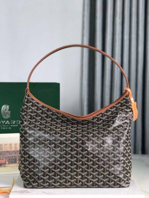 Bohème Hobo Bag. Authentic quality luxury bag crafted in genuine leather comes with authenticity card, dust bag and gift bag. Wander Freely. Carry Elegantly. Introducing the Goyard Bohème Hobo Bag—a tribute to Parisian spirit and wanderlust. Inspired by the timber raftsmen’s humble travel pouches, this bag blends heritage storytelling with everyday luxury. Crafted to be exceptionally lightweight and flexible, it drapes effortlessly on your shoulder with a wide, comfortable handle designed for long city strolls or spontaneous weekend escapes. Its beauty lies not only in its sleek silhouette but also in its thoughtful functionality. The secure zip closure keeps your essentials safe, while the removable snap-fastened pouch doubles as a chic clutch or wallet—perfect for a quick dash or stylish switch-up. Whether you’re wandering through cobblestone streets or navigating your daily routine, the Bohème ensures your essentials are always within reach. This is not just a bag—it’s your elegant partner in carefree adventures.