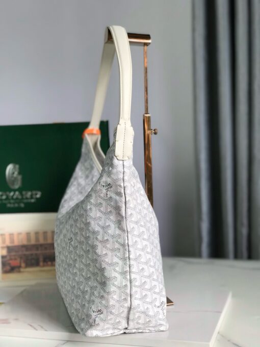 Bohème Hobo Bag. Authentic quality luxury bag crafted in genuine leather comes with authenticity card, dust bag and gift bag. Wander Freely. Carry Elegantly. Introducing the Goyard Bohème Hobo Bag—a tribute to Parisian spirit and wanderlust. Inspired by the timber raftsmen’s humble travel pouches, this bag blends heritage storytelling with everyday luxury. Crafted to be exceptionally lightweight and flexible, it drapes effortlessly on your shoulder with a wide, comfortable handle designed for long city strolls or spontaneous weekend escapes. Its beauty lies not only in its sleek silhouette but also in its thoughtful functionality. The secure zip closure keeps your essentials safe, while the removable snap-fastened pouch doubles as a chic clutch or wallet—perfect for a quick dash or stylish switch-up. Whether you’re wandering through cobblestone streets or navigating your daily routine, the Bohème ensures your essentials are always within reach. This is not just a bag—it’s your elegant partner in carefree adventures.