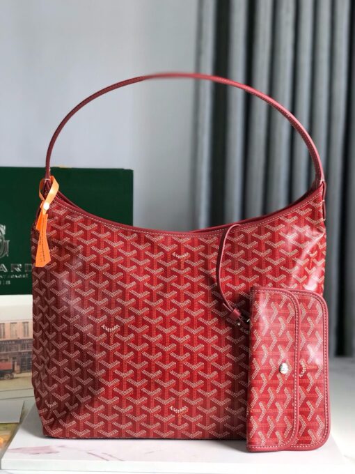 Bohème Hobo Bag. Authentic quality luxury bag crafted in genuine leather comes with authenticity card, dust bag and gift bag. Wander Freely. Carry Elegantly. Introducing the Goyard Bohème Hobo Bag—a tribute to Parisian spirit and wanderlust. Inspired by the timber raftsmen’s humble travel pouches, this bag blends heritage storytelling with everyday luxury. Crafted to be exceptionally lightweight and flexible, it drapes effortlessly on your shoulder with a wide, comfortable handle designed for long city strolls or spontaneous weekend escapes. Its beauty lies not only in its sleek silhouette but also in its thoughtful functionality. The secure zip closure keeps your essentials safe, while the removable snap-fastened pouch doubles as a chic clutch or wallet—perfect for a quick dash or stylish switch-up. Whether you’re wandering through cobblestone streets or navigating your daily routine, the Bohème ensures your essentials are always within reach. This is not just a bag—it’s your elegant partner in carefree adventures.