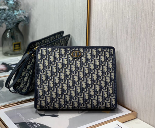 30 Montaigne Dea Pouch. Authentic quality luxury bag crafted in genuine leather comes with authenticity card, dust bag and gift bag. Effortless Elegance, Perfectly Packaged. Elevate your everyday with the 30 Montaigne Dea pouch- where timeless Dior heritage meets modern utility.Expertly crafted in iconic *ior Oblique jacquard and finished with the elegant CD signature, this pouch is more than just an accessory — it’s a statement. Its spacious interior offers room for your essentials, while the structured silhouette transitions effortlessly from clutch to organizer within your *ior Book Tote. Whether carried solo or nested in your favorite bag, the Dea pouch is your answer to understated sophistication with unmistakable style.