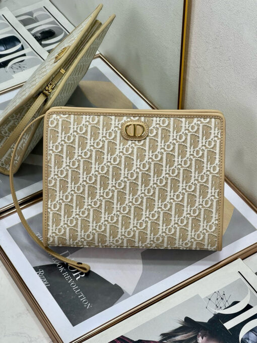 30 Montaigne Dea Pouch. Authentic quality luxury bag crafted in genuine leather comes with authenticity card, dust bag and gift bag. Effortless Elegance, Perfectly Packaged. Elevate your everyday with the 30 Montaigne Dea pouch- where timeless Dior heritage meets modern utility.Expertly crafted in iconic *ior Oblique jacquard and finished with the elegant CD signature, this pouch is more than just an accessory — it’s a statement. Its spacious interior offers room for your essentials, while the structured silhouette transitions effortlessly from clutch to organizer within your *ior Book Tote. Whether carried solo or nested in your favorite bag, the Dea pouch is your answer to understated sophistication with unmistakable style.