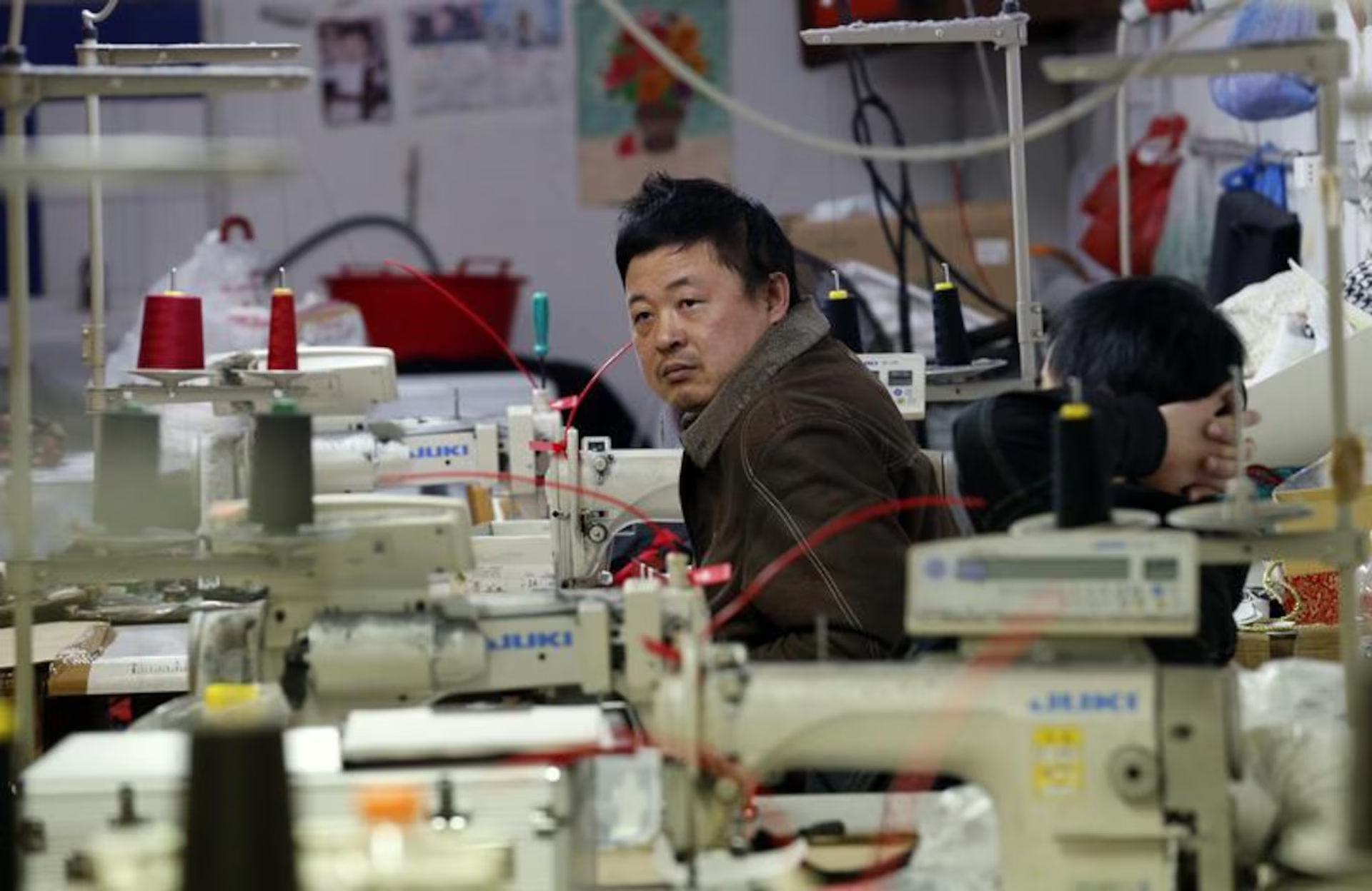 Hands that stitch luxury in silence. The unseen labor behind the label.