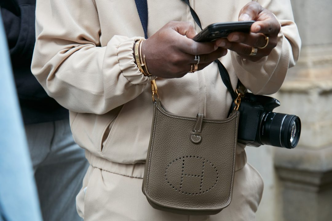 A casual streetwear look with a grey leather bag from the collection, highlighting effortless style.