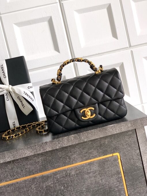 Mini Handy CC Flap Bag. Authentic quality luxury bag crafted in genuine leather comes with authenticity card, dust bag and gift bag. Petite yet powerful, the Caviar Quilted Mini Handy CC Flap embodies timeless sophistication. Crafted from signature caviar leather with classic diamond quilting, this bag exudes refined elegance in every stitch. The design features a structured top handle and a leather-threaded chain strap, offering versatile styling from hand-carry to crossbody. Gold-plated CC details and the signature turn-lock closure add the perfect touch of luxury. Inside, a sleek leather interior with both zipper and patch pockets ensures your essentials stay beautifully organized. Compact, iconic, and unmistakably *ANEL — this is the ultimate statement in modern classic style.
