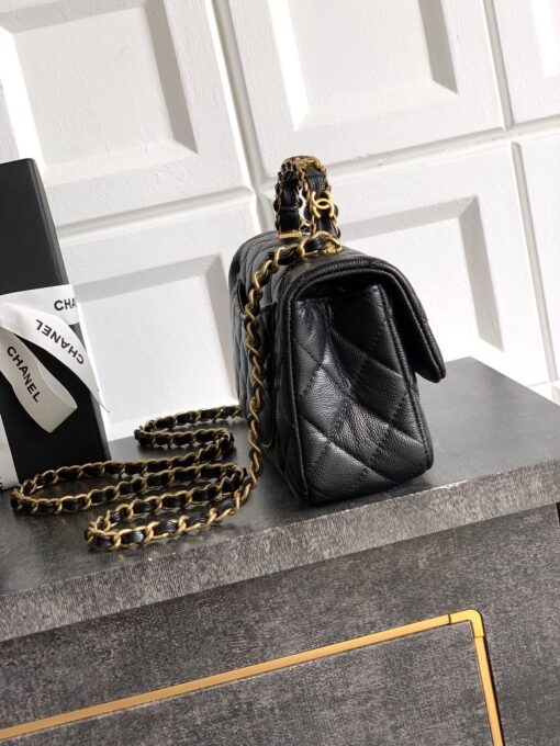 Mini Handy CC Flap Bag. Authentic quality luxury bag crafted in genuine leather comes with authenticity card, dust bag and gift bag. Petite yet powerful, the Caviar Quilted Mini Handy CC Flap embodies timeless sophistication. Crafted from signature caviar leather with classic diamond quilting, this bag exudes refined elegance in every stitch. The design features a structured top handle and a leather-threaded chain strap, offering versatile styling from hand-carry to crossbody. Gold-plated CC details and the signature turn-lock closure add the perfect touch of luxury. Inside, a sleek leather interior with both zipper and patch pockets ensures your essentials stay beautifully organized. Compact, iconic, and unmistakably *ANEL — this is the ultimate statement in modern classic style.