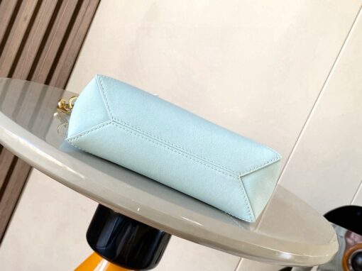 Puzzle Fold Pouch. Authentic quality luxury bag crafted in genuine leather comes with authenticity card, dust bag and gift bag. Sculpted Sophistication — The Art of Function. The Puzzle Fold Pouch redefines modern elegance with its sculptural geometry and effortless versatility. Crafted in luxurious shiny nappa calfskin, its signature folded panels create a dynamic, architectural silhouette that’s instantly recognizable. Both stylish and practical, this pouch transitions seamlessly from day to night—perfect for carrying essentials with a touch of *OEWE sophistication. A masterpiece of craftsmanship, it’s the ultimate blend of innovation and timeless design.