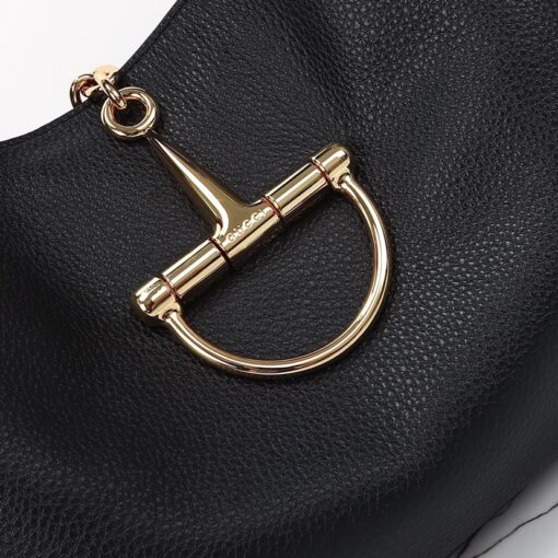 Softbit Maxi Shoulder Bag. Authentic quality luxury bag crafted in genuine leather comes with authenticity card, dust bag and gift bag. Icon Reimagined: Effortless Luxury with a Modern Bit of Bold. *ucci’s timeless heritage meets contemporary ease in the new Softbit Shoulder Bag. Crafted from supple grained leather with a luxuriously rich texture, this piece balances sophistication and function effortlessly. At its heart lies an oversized half-horsebit — a bold reinterpretation of the House’s iconic detail — accenting the magnetic closure with statement appeal. With its relaxed silhouette and refined craftsmanship, the Softbit is the perfect companion for those who favor effortless elegance with a modern edge.