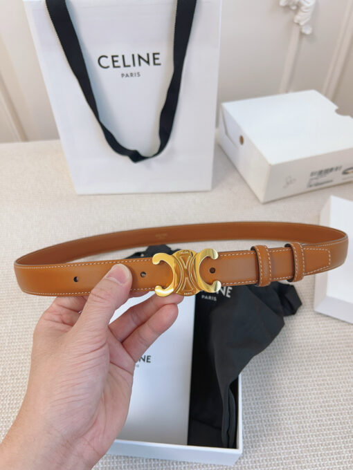 Border Triomphe Belt. Authentic quality luxury bag crafted in genuine leather comes with authenticity card, dust bag and gift bag. Where Parisian Precision Meets Effortless Elegance. The Border Triomphe Belt embodies Parisian refinement in its purest form. Crafted from luxurious smooth calfskin, this elegant accessory is framed by subtle contrasting borders that highlight its sleek lines and meticulous craftsmanship. At its center, the iconic Triomphe buckle—an emblem of *ELINE’s timeless heritage—adds a touch of golden sophistication. Whether paired with tailored trousers, a flowing dress, or high-waisted denim, this belt transforms any outfit into a statement of effortless elegance. A true symbol of quiet luxury, the Border Triomphe Belt is the ultimate finishing touch for those who appreciate understated glamour and modern French allure.